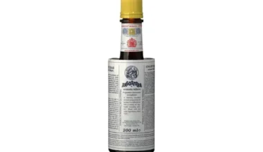 A 200ml bottle of Angostura Aromatic Bitters with yellow cap and signature oversized label – ideal for cocktails and culinary use.